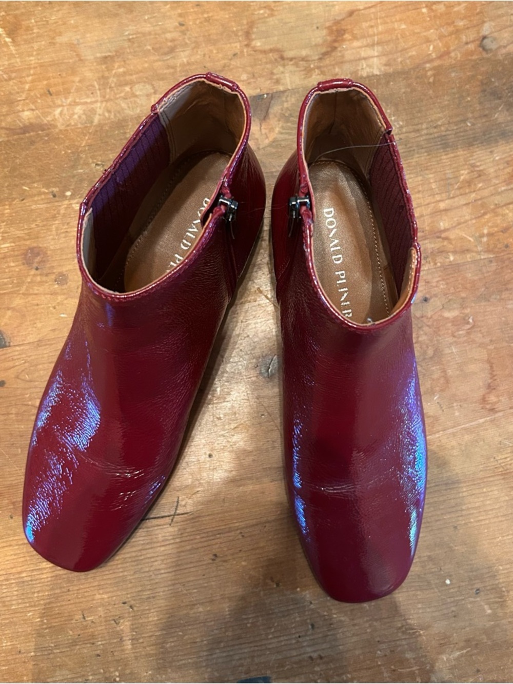 Donald Pliner Dasia square toe chelsea boot in Cranberry crinkle patent leather.